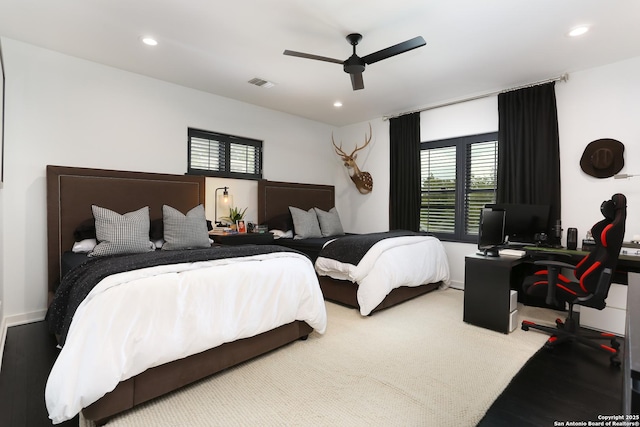 bedroom featuring ceiling fan and carpet