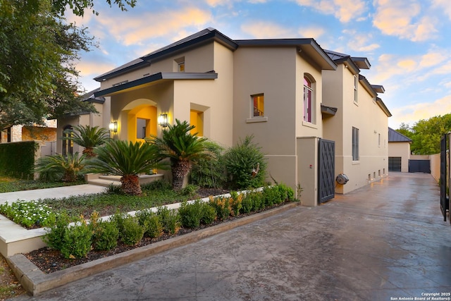 view of property exterior at dusk