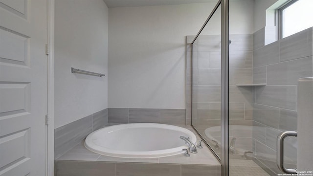 2607 Vistablue Ln, San Antonio, TX 78245 - bathroom featuring a bath and a shower stall
