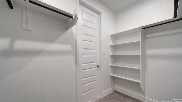 2607 Vistablue Ln, San Antonio, TX 78245 - spacious closet featuring carpet flooring