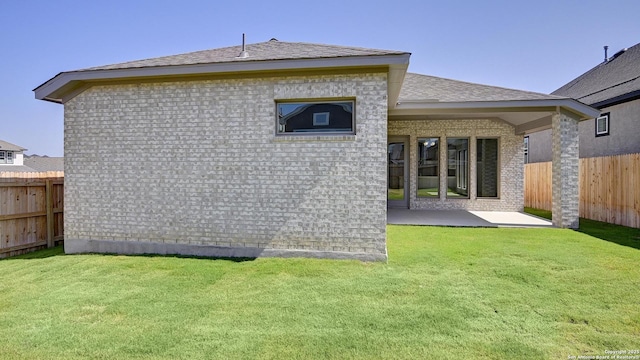 2607 Vistablue Ln, San Antonio, TX 78245 - rear view of property with a patio area, brick siding, and a shingled roof
