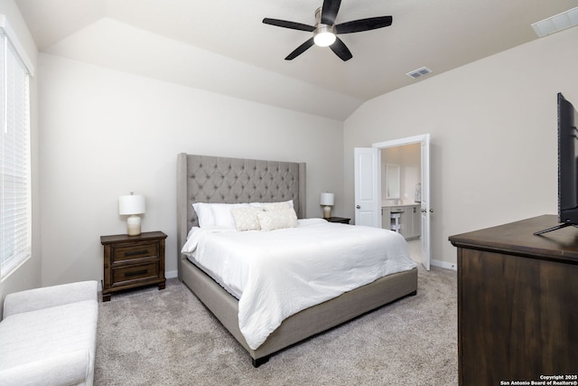 bedroom featuring lofted ceiling, light colored carpet, and ceiling fan