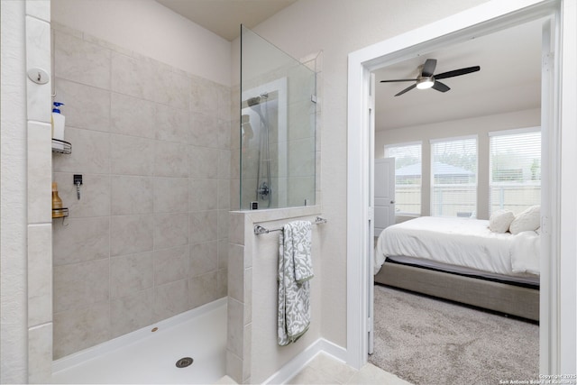 bathroom with ceiling fan, tile patterned floors, and a tile shower