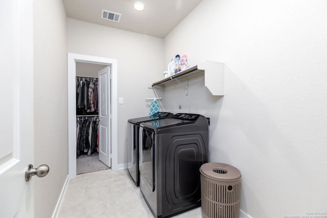 laundry room with washer and dryer