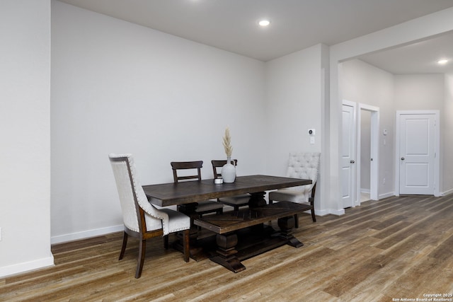 dining room with dark wood-type flooring