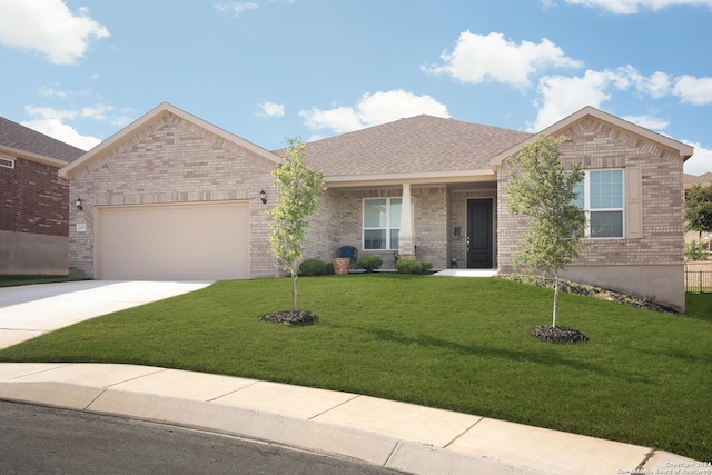 view of front of property with a garage and a front lawn