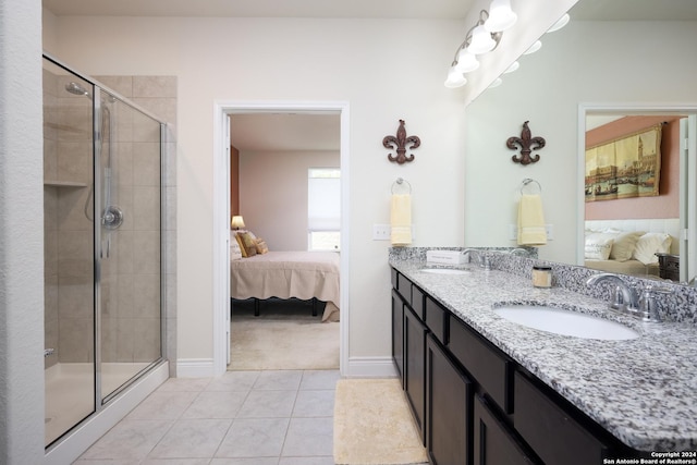 bathroom with walk in shower, tile patterned floors, and vanity