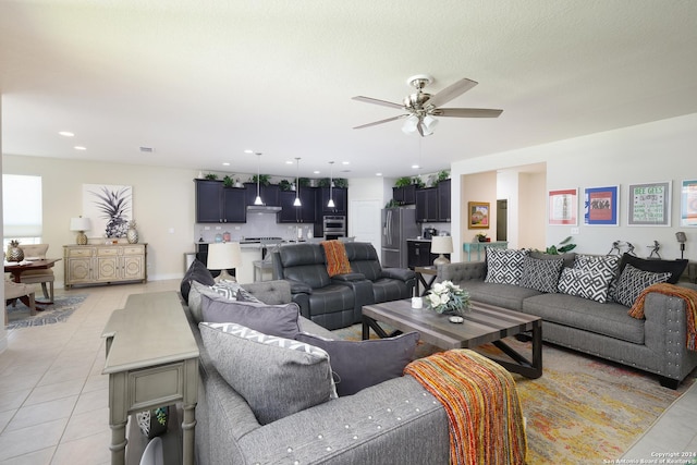 living room with ceiling fan and light tile patterned flooring