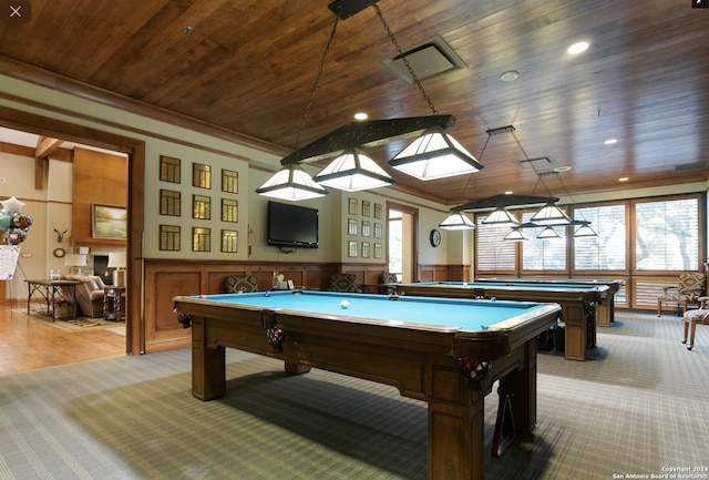 game room featuring wood ceiling, pool table, crown molding, and light carpet