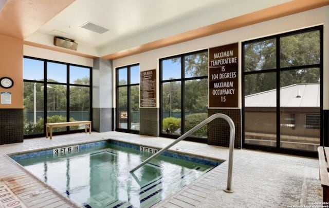 view of swimming pool featuring an indoor in ground hot tub