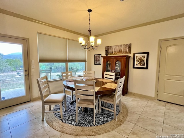 dining space featuring light tile patterned flooring, ornamental molding, and a notable chandelier