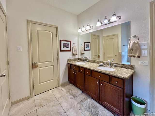 bathroom featuring vanity and tile patterned flooring