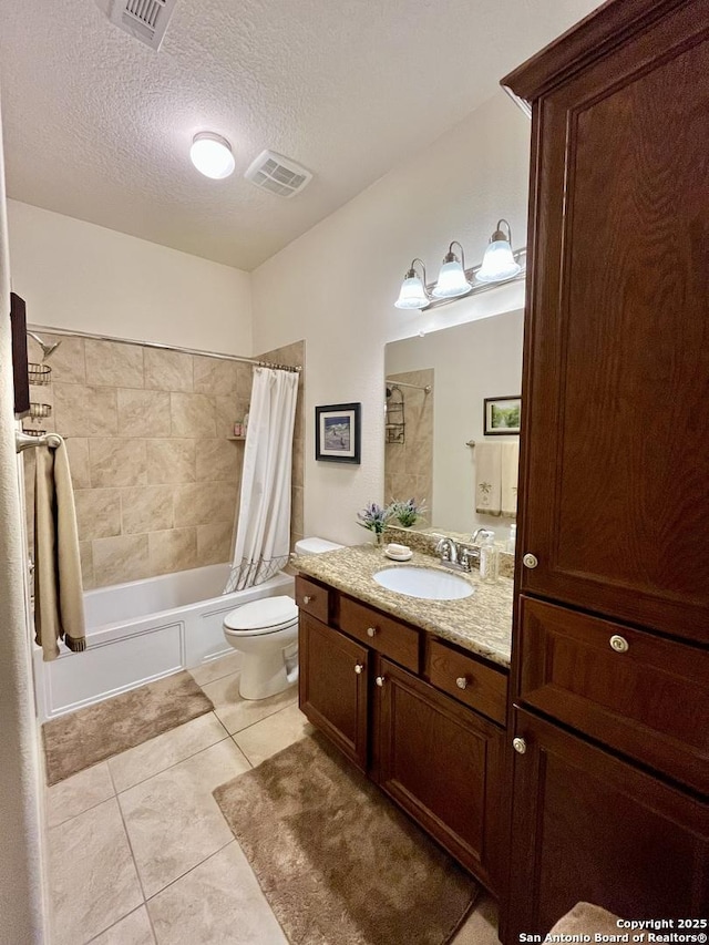 full bathroom featuring toilet, a textured ceiling, vanity, shower / bathtub combination with curtain, and tile patterned flooring