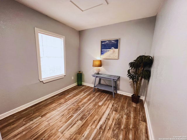 unfurnished room with hardwood / wood-style floors