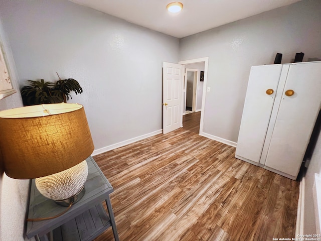 unfurnished room featuring wood-type flooring