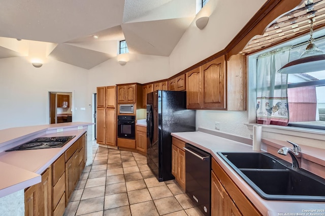 kitchen with light tile patterned floors, lofted ceiling, sink, and black appliances