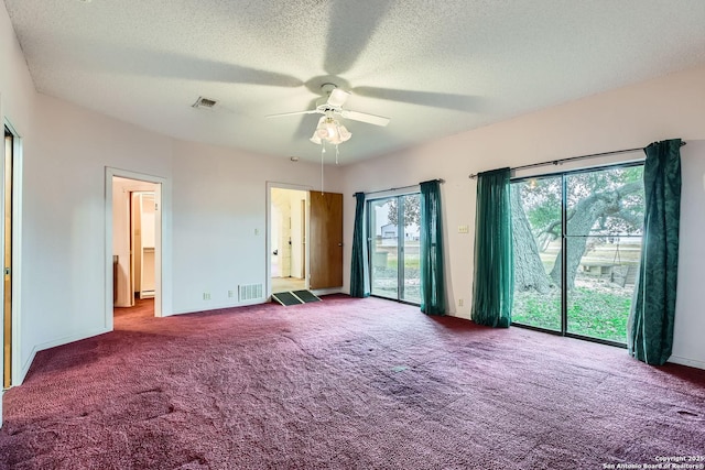 unfurnished room featuring ceiling fan, carpet flooring, and a textured ceiling