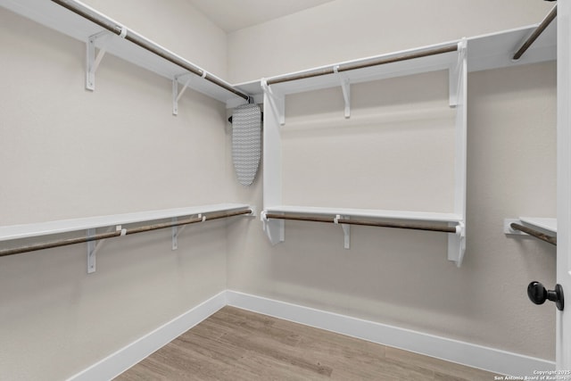 spacious closet featuring hardwood / wood-style floors