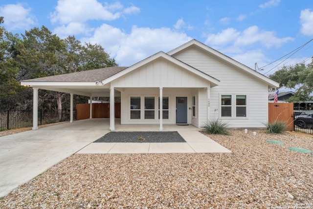 view of front of property featuring a carport