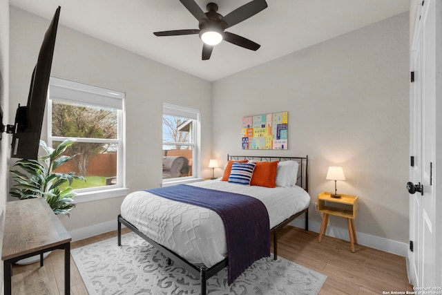 bedroom featuring ceiling fan and light hardwood / wood-style flooring