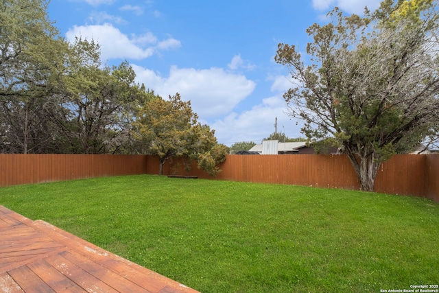 view of yard featuring a wooden deck