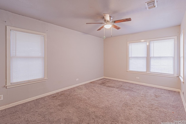 empty room with carpet floors and ceiling fan