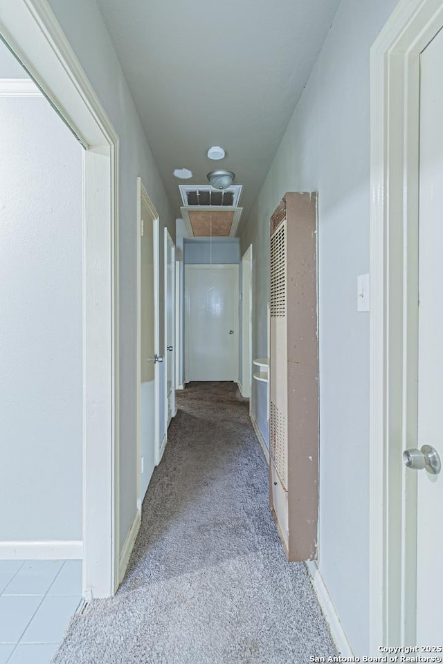 hall featuring light colored carpet