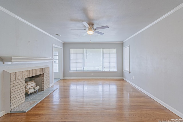 unfurnished living room featuring crown molding, light hardwood / wood-style flooring, and plenty of natural light