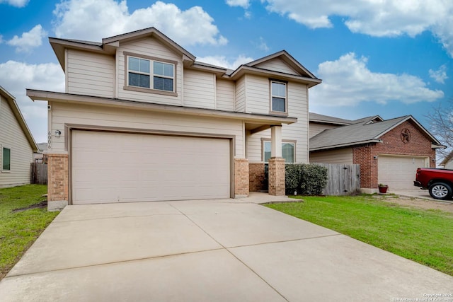 view of front of property with a garage and a front lawn