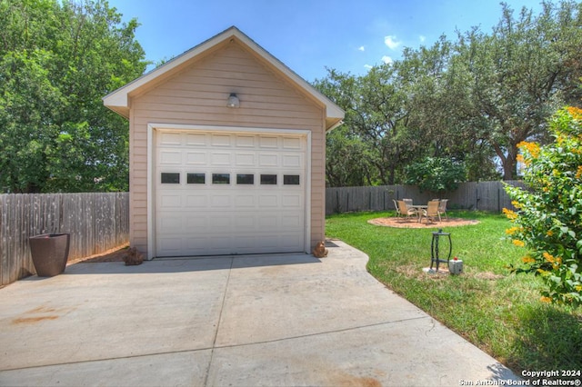 garage featuring a yard
