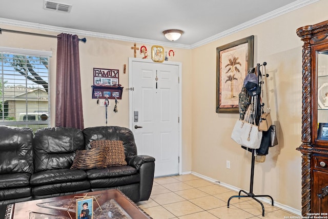 living room with ornamental molding and light tile patterned floors