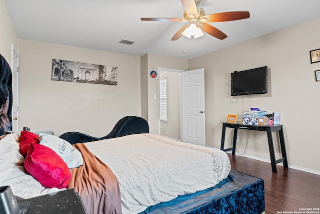 bedroom with dark wood-type flooring and ceiling fan