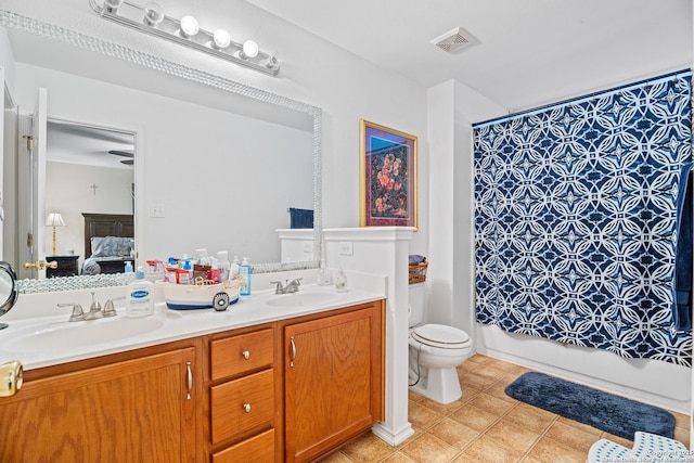 full bathroom featuring toilet, vanity, shower / bathtub combination with curtain, and tile patterned flooring