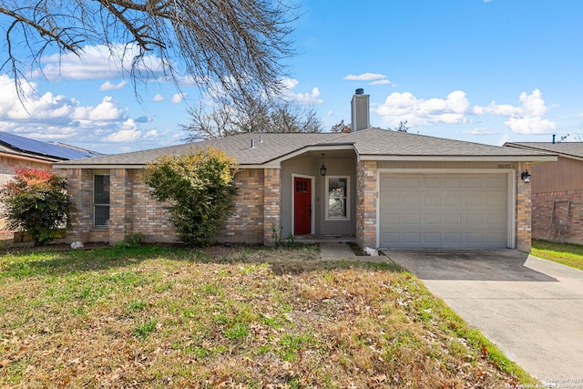 ranch-style house featuring a garage and a front yard