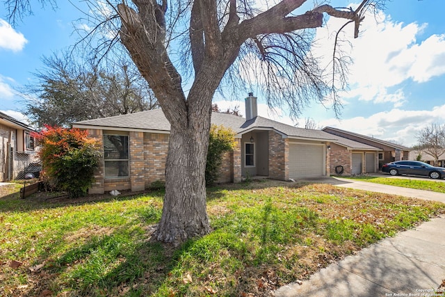 ranch-style home featuring a garage and a front yard