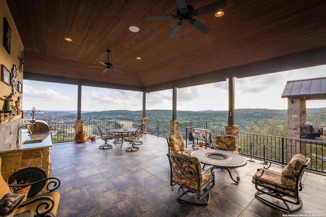 view of patio with ceiling fan and exterior kitchen