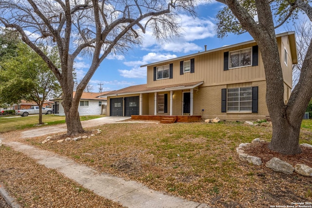 view of front of house with a garage, a porch, and a front lawn