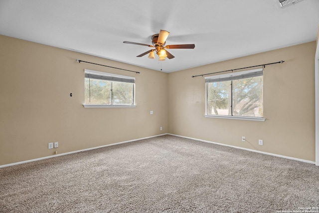 empty room with carpet flooring and ceiling fan