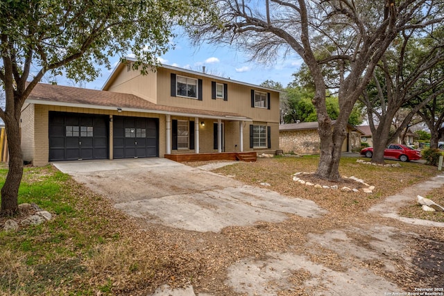 view of front facade featuring a garage and covered porch