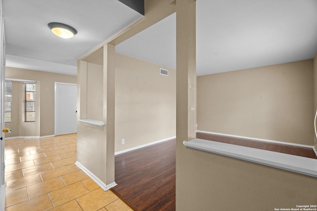 hall with light hardwood / wood-style floors