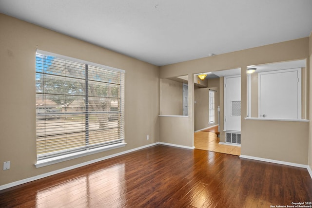 unfurnished living room with hardwood / wood-style flooring