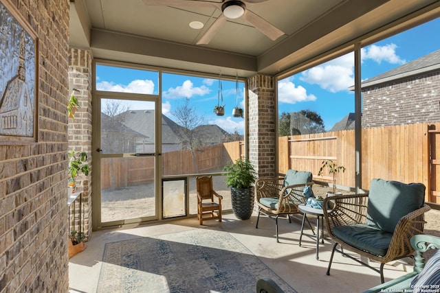 sunroom featuring plenty of natural light and ceiling fan