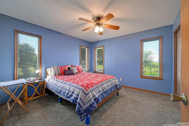 carpeted bedroom featuring ceiling fan