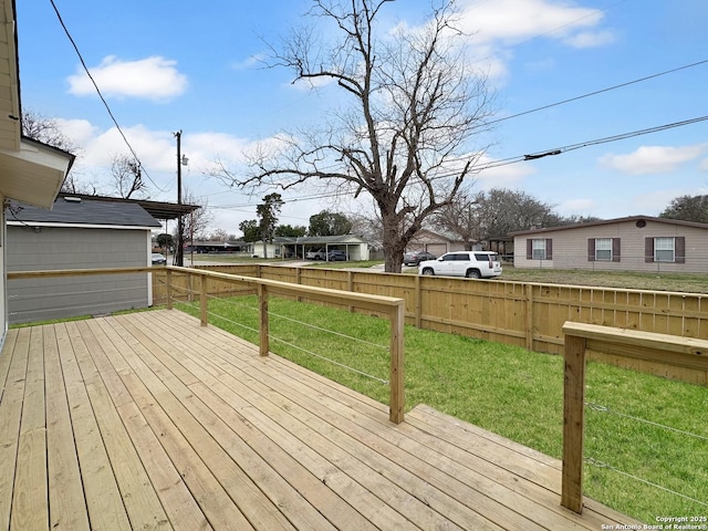 wooden deck with a yard