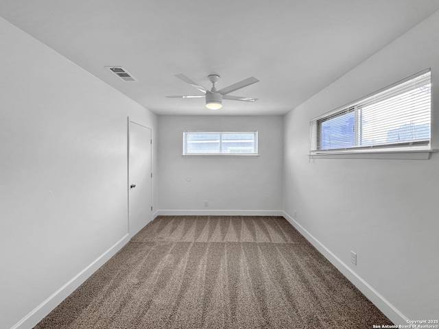 carpeted empty room with ceiling fan