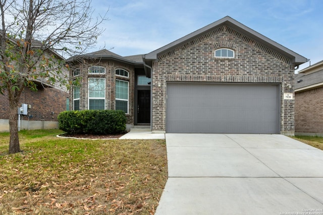 front facade featuring a garage and a front yard