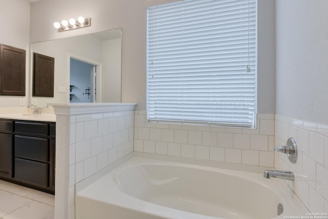 bathroom with vanity and a tub