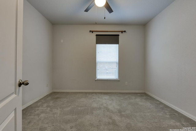 unfurnished room featuring light carpet and ceiling fan