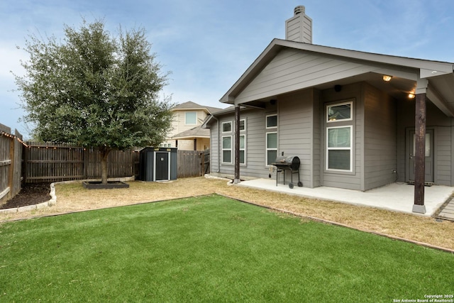 rear view of house with a lawn and a patio area