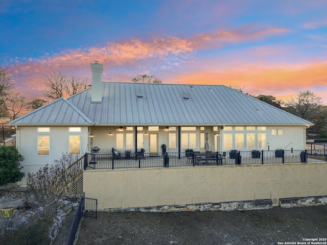 exterior space with ceiling fan and a porch